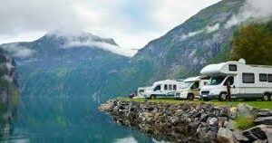 RV and motorhomes camping on clif overlooking lake and mountains